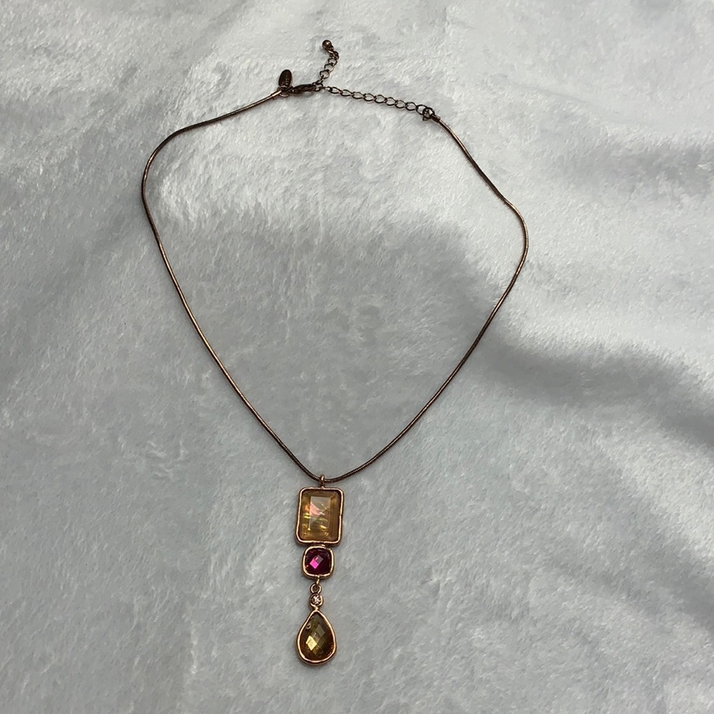 Gold/pearlescent and pink jeweled necklace.